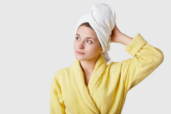 Indoor Shot Pretty Dreamy Woman Wears Bathrobe Towel Feels Relaxed — Stock Photo, Image