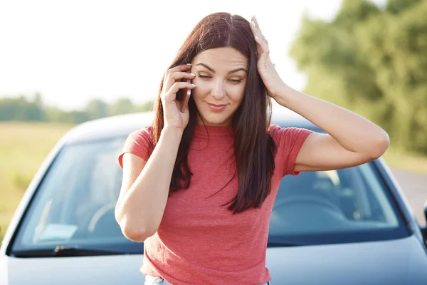 Horizontal Shot Brunette Pretty Woman Has Telephone Conversation Holds Mobile — Stock Photo, Image