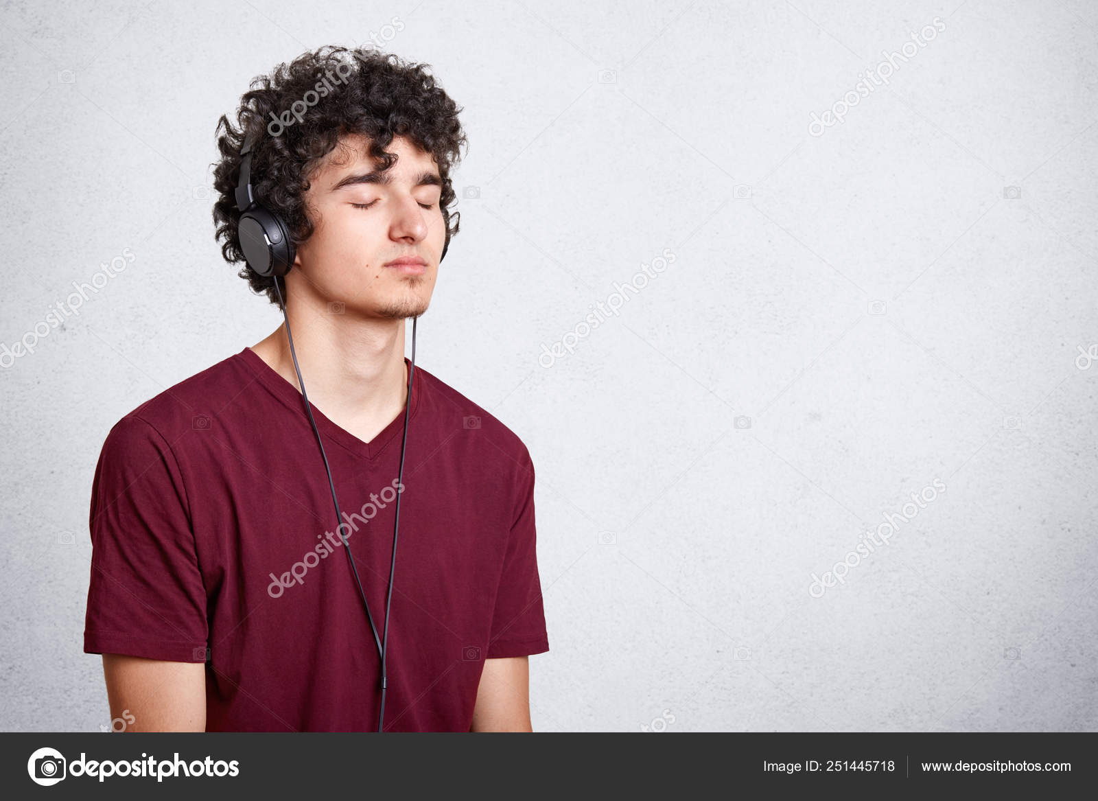 Portrait Of Young Attractive Guy Enjoys Of Listening To Music