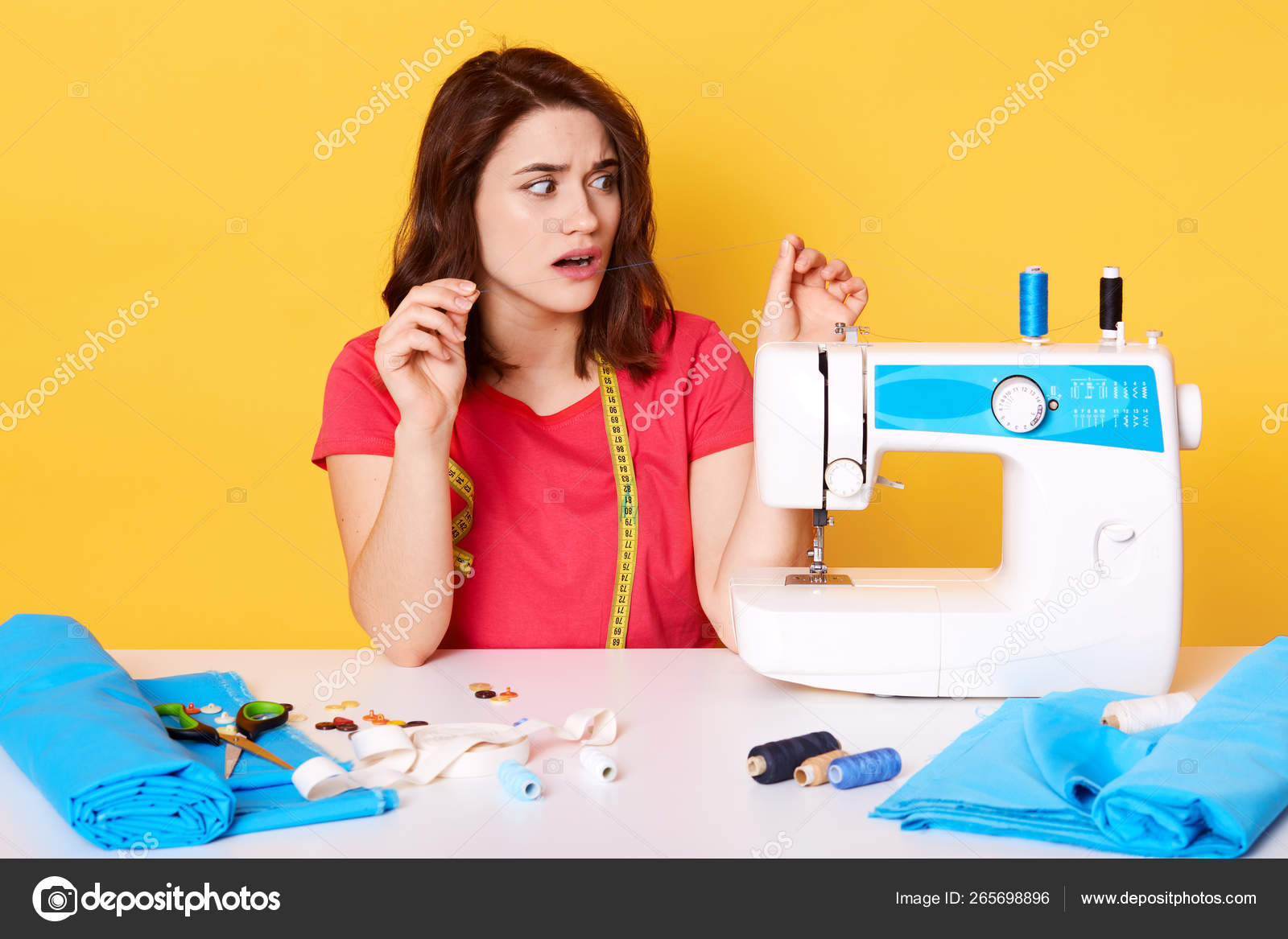 pattern, scissors, tape measure, and a sewing machine. Workplace