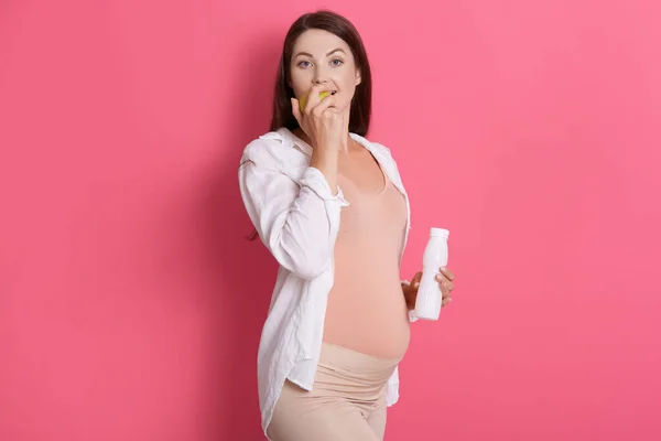 Pregnant Woman Bottle Milk Hand Biting Apple Eating Vitamins Wearing — Stock Photo, Image