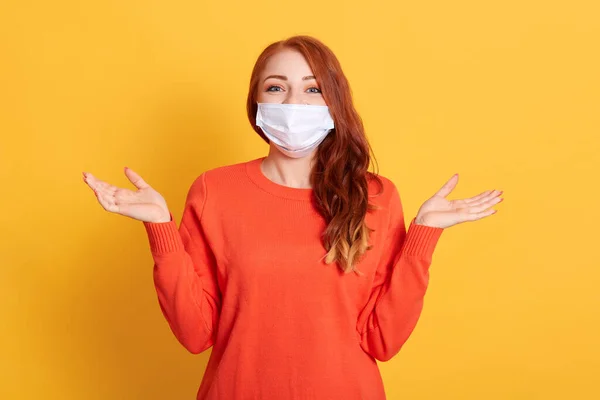 Young Red Haired Woman Protective Medical Mask Spreading Hands Aside — Stock Photo, Image