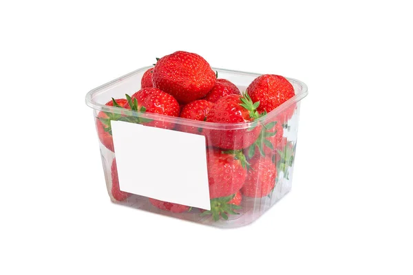Caja de plástico de fresas y etiqueta blanca — Foto de Stock
