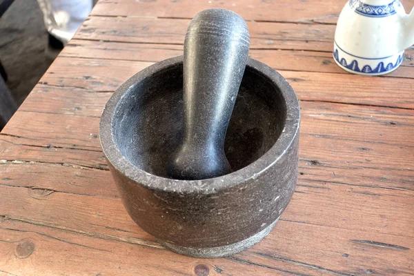 Pestle and mortar on rustic wooden table