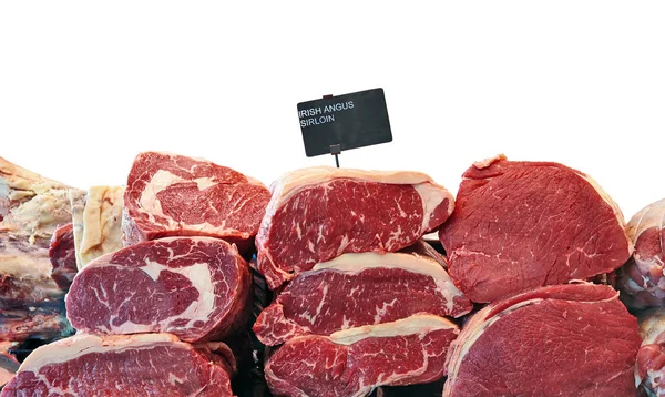 Fridge counter with variety of Irish angus beef meat isolated