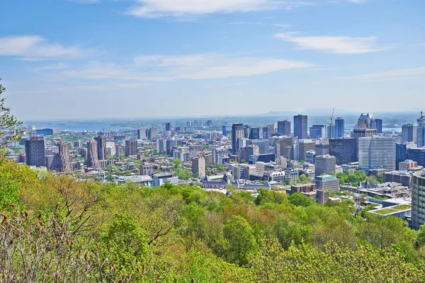 Skyline Panorama of the city of Montreal, Quebec, Canada. Shot from the Mount Royal above the city.