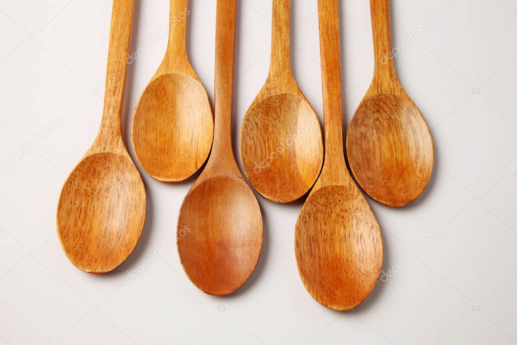 group of wooden spoons on white background