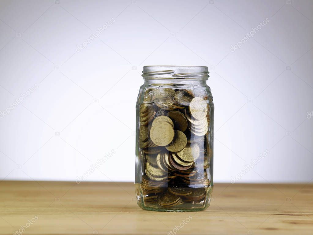 saving concept of saving jar and coins
