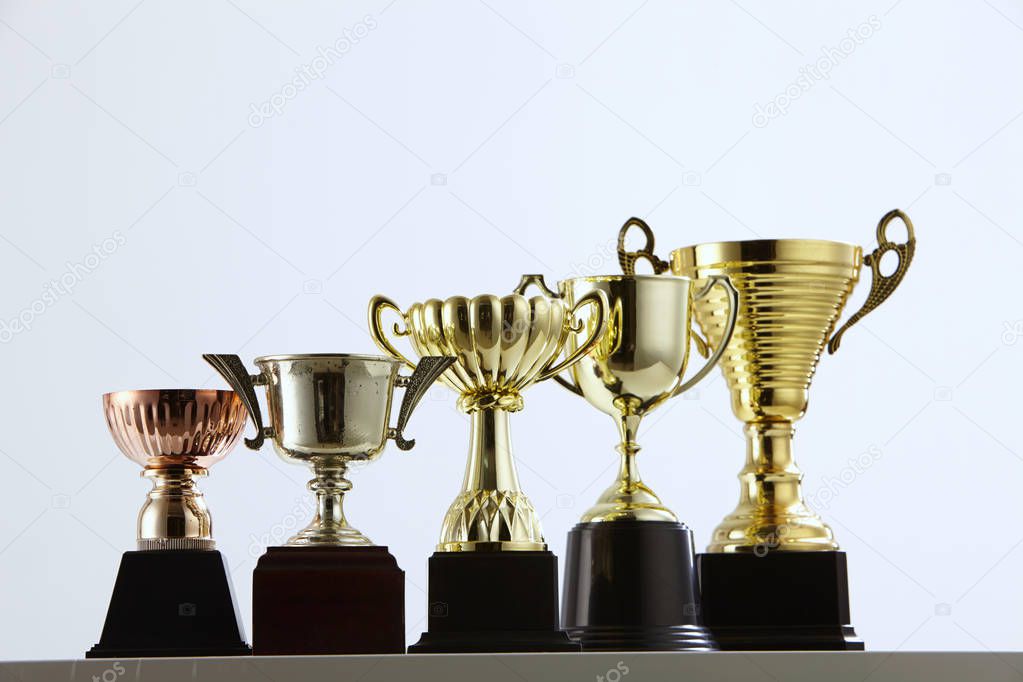 close up of trophies arranged in row