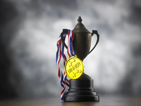 close up of vintage trophy with golden medal