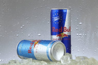 Kuala Lumpur, Malaysia - March 14, 2017: red bull aluminum can in freezer with ice cubes clipart