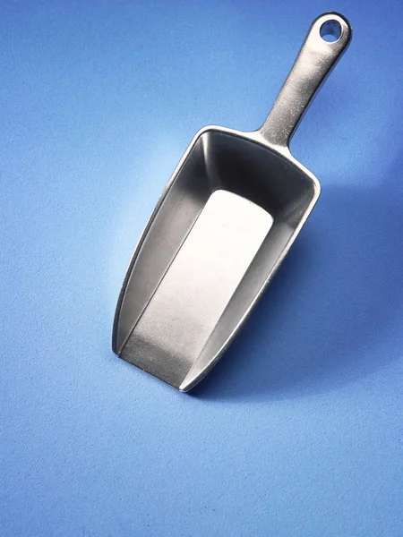 Empty Metal Spoon Blue Background — Stock Photo, Image