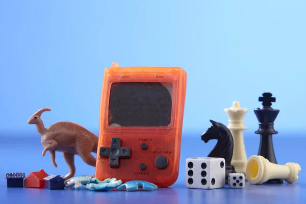 outdated handheld electronic game and other toys