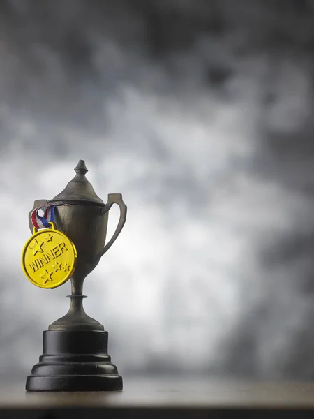 close up of vintage trophy with golden medal