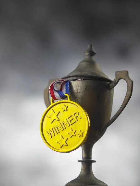 close up of vintage trophy with golden medal