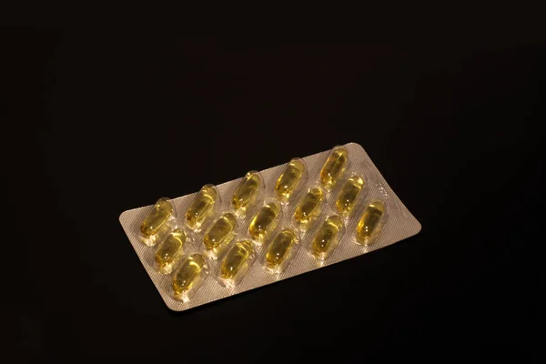 Pills Fish Oil Capsules Pack Reflected Black Mirror Table — Stock Photo, Image