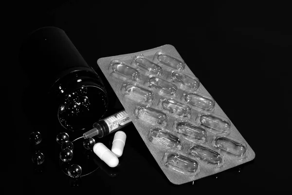 Pills Fish Oil Capsules Jar Pills Syringe Pack Reflected Black — Stock Photo, Image