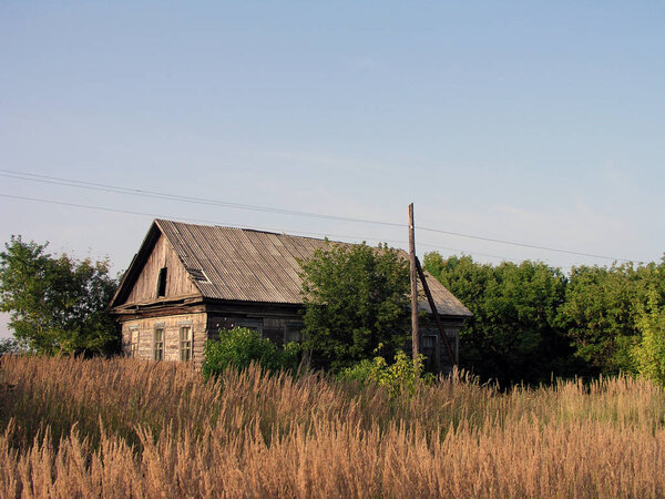 Old house in the Russian village against the sky