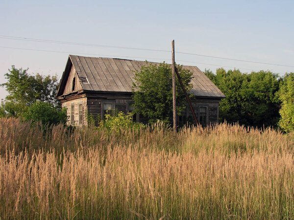 Old house in the Russian village against the sky
