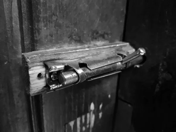 Old latch or heck on a wooden door — Stock Photo, Image