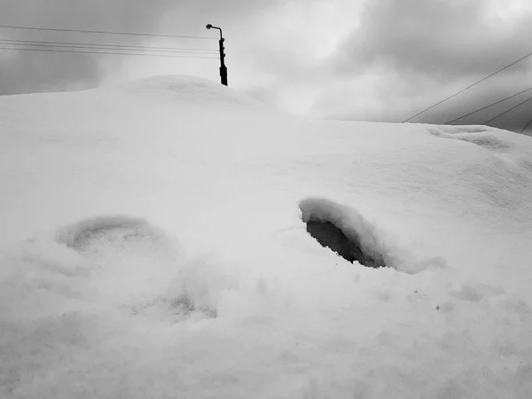 Beautiful lonely traces of man snow in winter — Stock Photo, Image