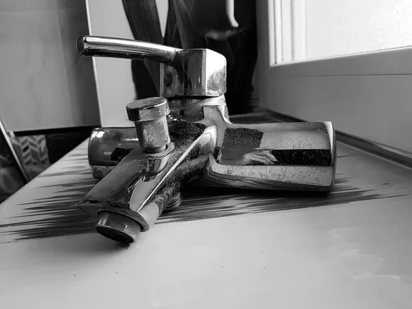 Repair and construction - water tap on a tile in the bathroom — Stock Photo, Image