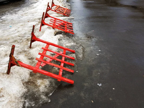 Road fencing or repair fence lies on the pavement