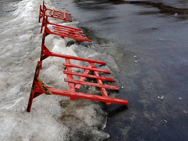 Road fencing or repair fence lies on the pavement