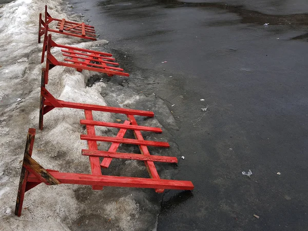 Road fencing or repair fence lies on the pavement