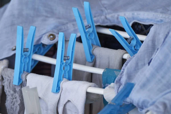 Washed clothes on a drying rack