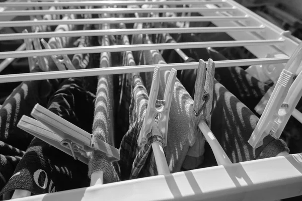 Washed clothes on a drying rack