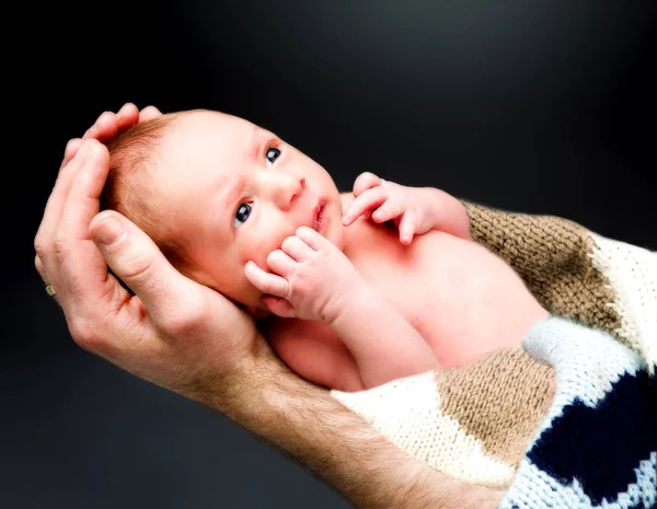 Newborn baby boy on the fathers hand. — Stock Photo, Image