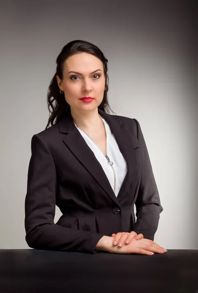 Portrait of wonderful business woman on gray background — Stok Foto