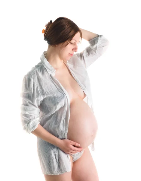 Donna incinta, incinta su sfondo bianco, primo piano della pancia incinta — Foto Stock