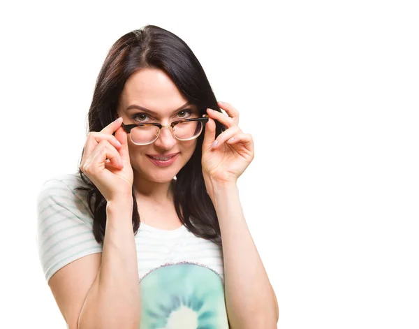 Woman with her glasses lifted up cant see — ストック写真