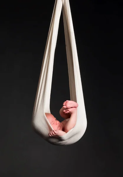 Stork Baby Package. 14 days old newborn baby boy carried in white cloth — Stock Photo, Image