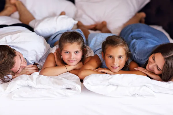 Happy family relaxing in hotel room — Stock Photo, Image