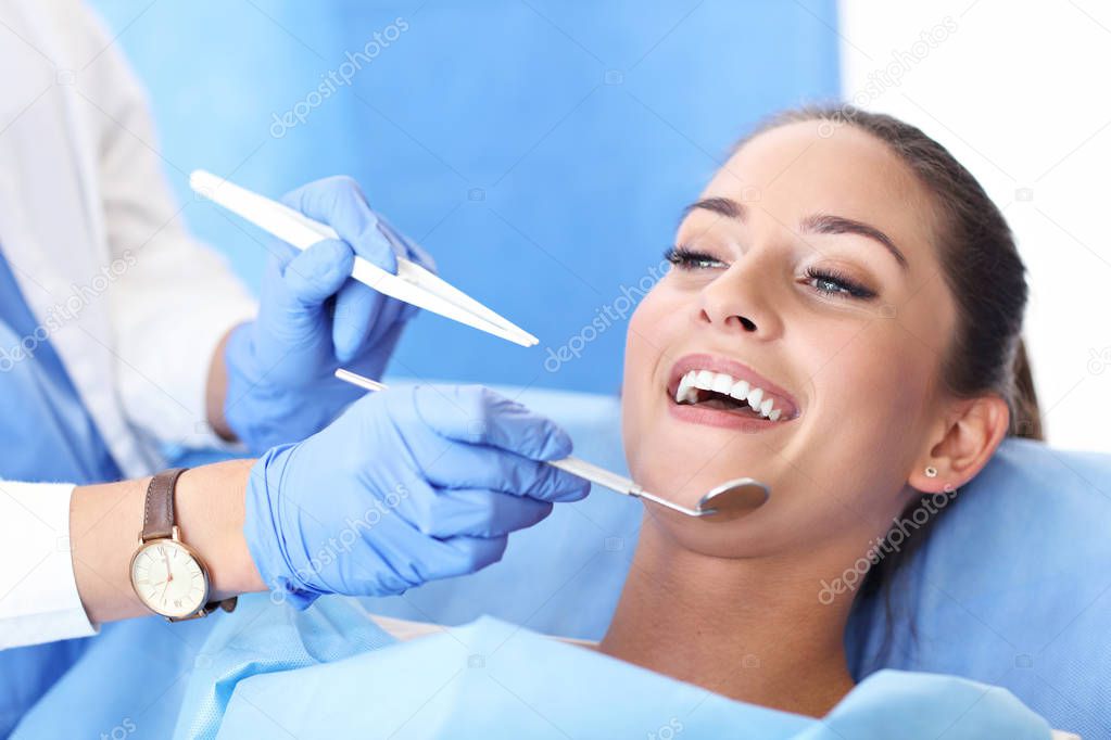 Adult woman having a visit at the dentists