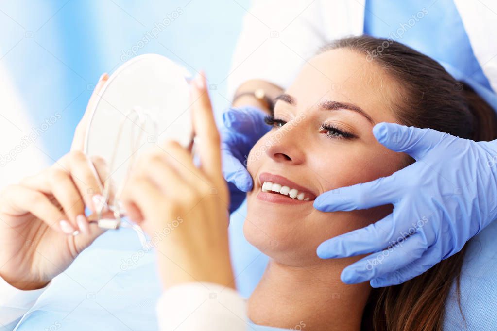 Adult woman having a visit at the dentists