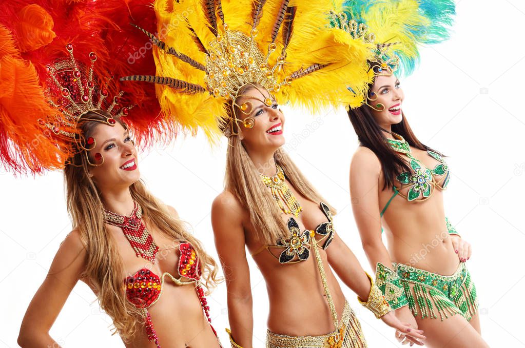 Brazilian women dancing samba over white background