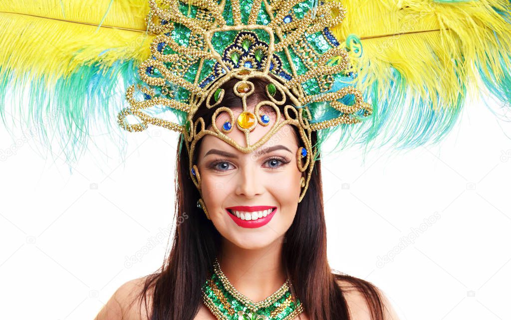 Brazilian woman posing in samba costume over white background