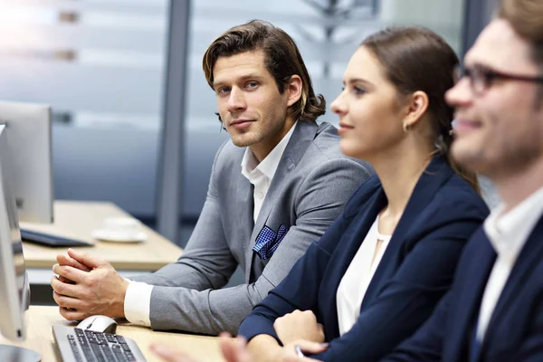 Group of business people attending a conference — Stock Photo, Image