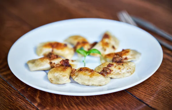 Fresh dumplings served on white plate — Stock Photo, Image