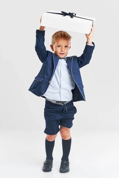 Portrait of happy cute little kid holding gift — Stock Photo, Image