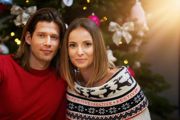 Beautiful couple celebrating Christmas at home Stock Image