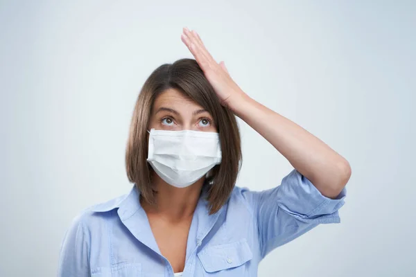 Attractive woman wearing protective mask isolated over white background — Stock Photo, Image