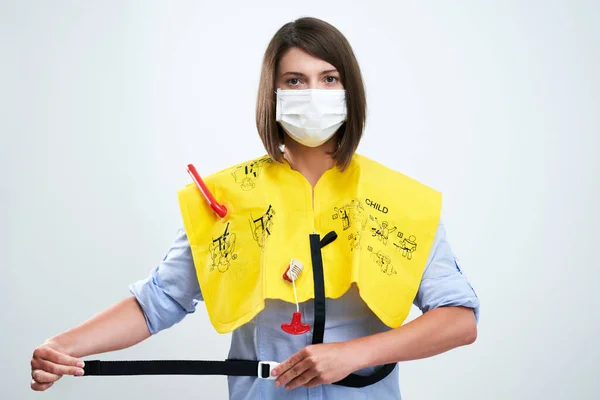 Stewardess wearing protective mask isolated over white background — Stock Photo, Image