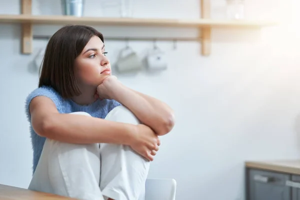 Sad teenager sitting alone at home — Stock Photo, Image