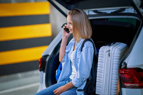 Adult woman tourist in underground airport parking lot — Stock Photo, Image