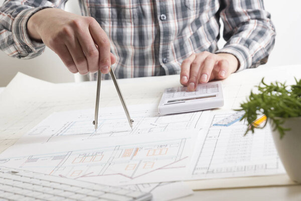 Architects working on blueprint, real estate project. Architect workplace. Construction concept. Engineering tools.